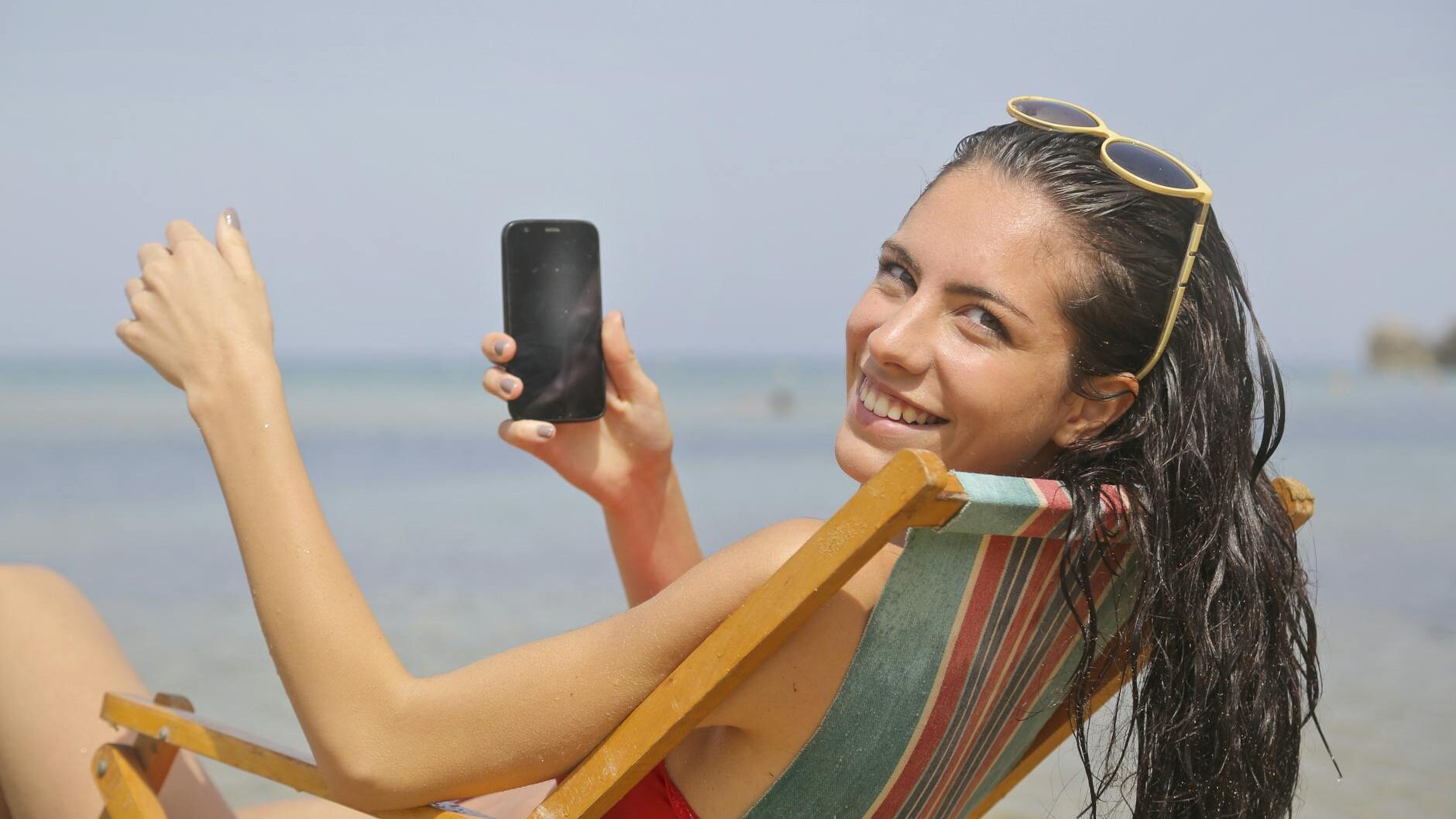 woman sitting on sun lounger