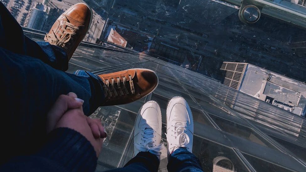 people standing on top of a building