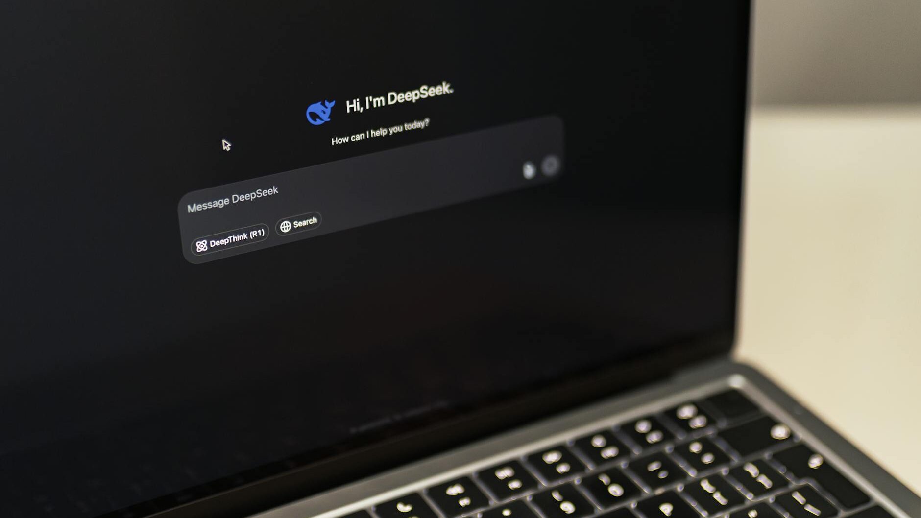 macbook with deepseek ai interface displayed