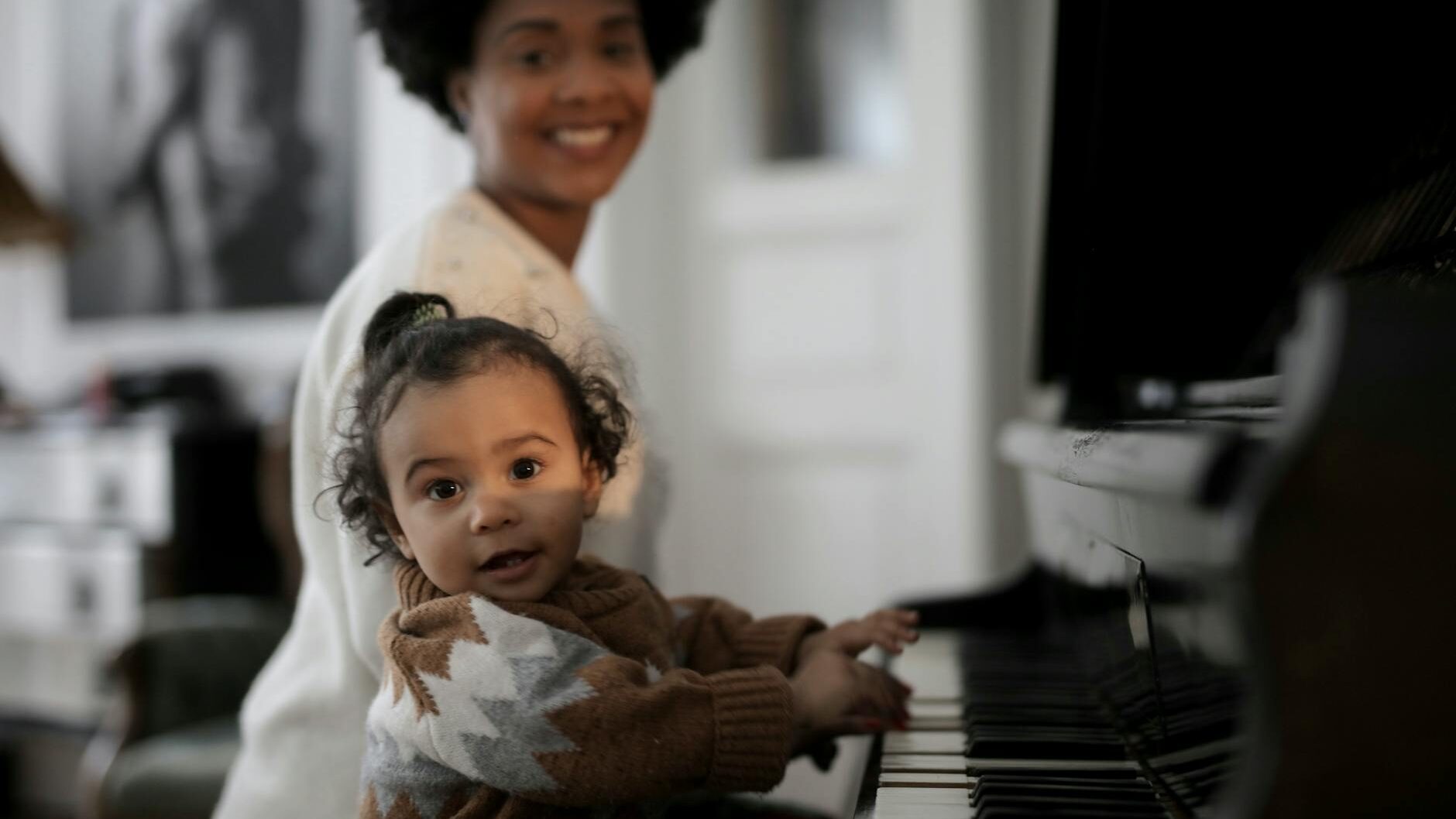 photo of toddler playing piano